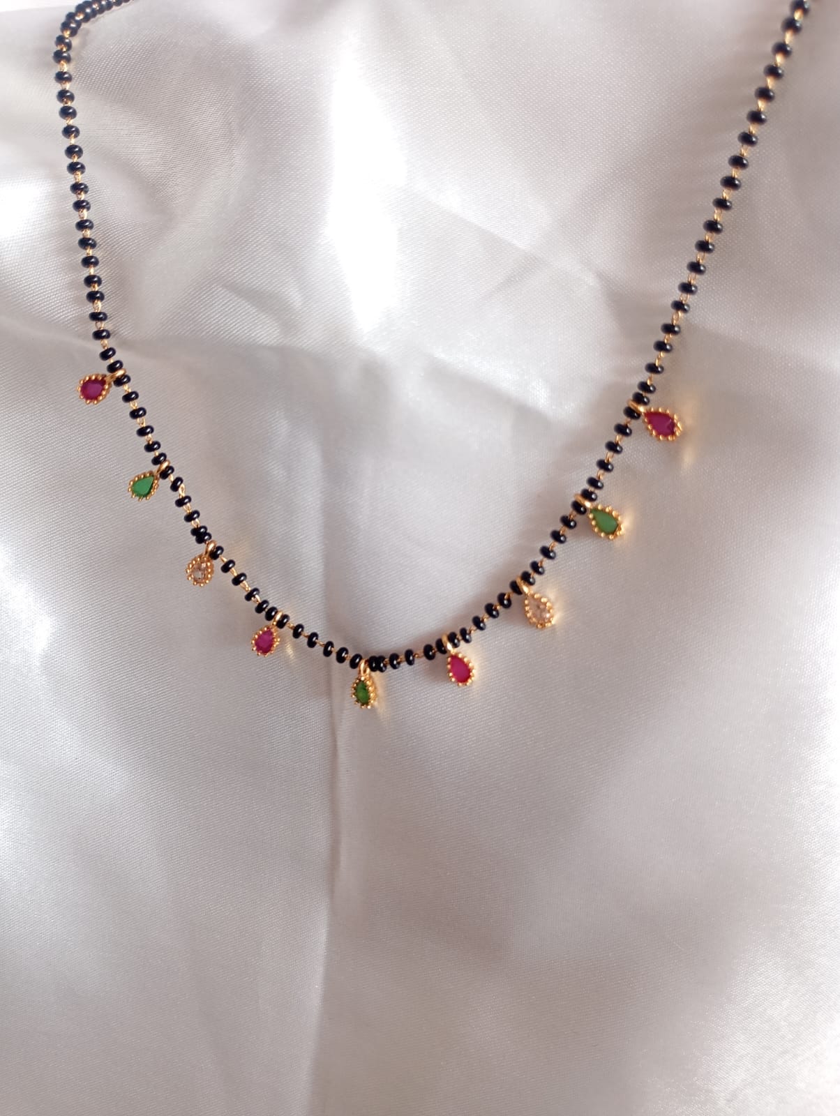 Black Bead Mangalsutra Necklace with Cubic Zirconia Teardrop Charms, Gold-Plated .